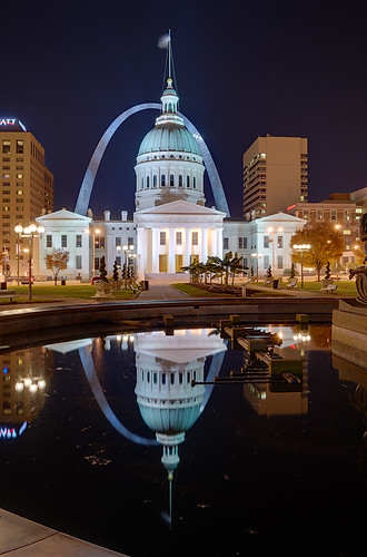 Old Courthouse and Gateway Arch, in downtown Saint Louis, Missouri, USA - view at night with reflection