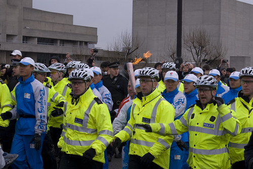 Olympic Torch and a Phalanx Of Security