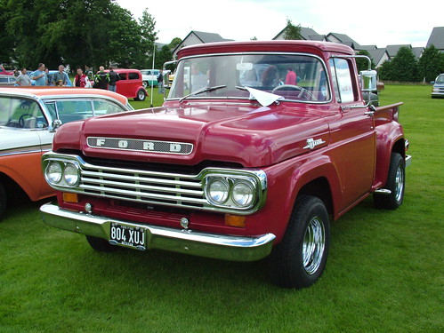 A cross in the center of this restored 1954 Ford F100's grille above