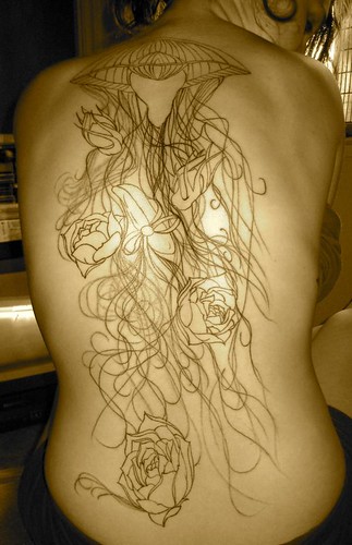 tattoos of jellyfish. jellyfish and roses back