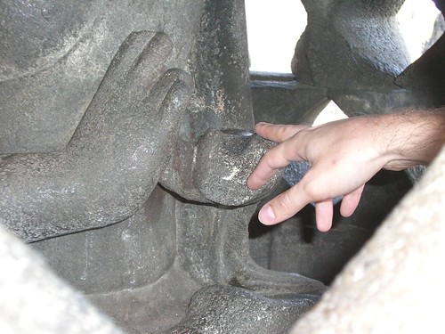 Touching Buddha's finger for luck ©  S Z