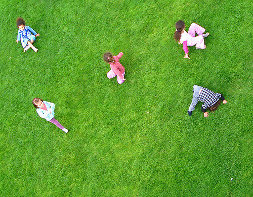 Children playing on the grass.