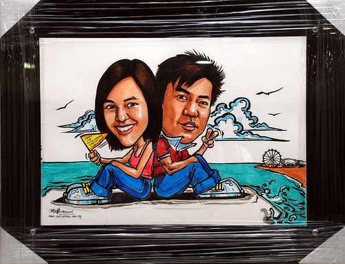 Couple caricatures at wave breaker black acrylic frame