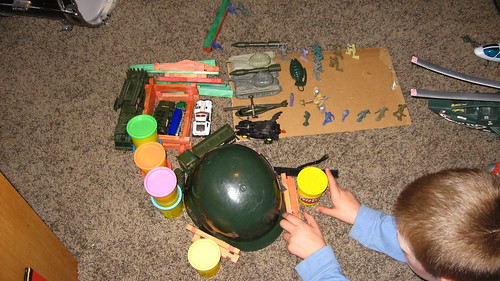 Caiden playing war with Henry (henry is under the helmet)