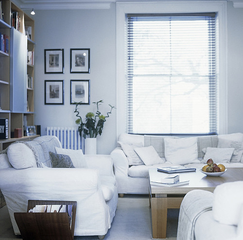 The modern white wall unit with gorgeous sitting room sofa