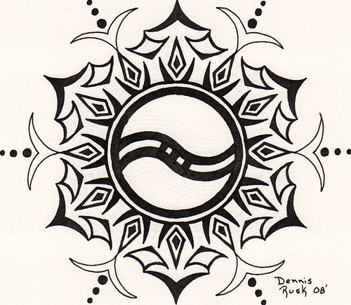 Tribal tattoo design that was made with one circle and in surrounded by temporary tattoo and henna tattoo so as to be seen so perfect