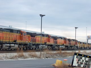 BNSF Railway and Union Pacific westbound trains running side by side. Hodgkins Illinois. January 2007.
