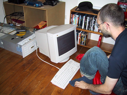 Peterv setting up Mozilla-Europe's saved-from-the-dump HP server in his dining room