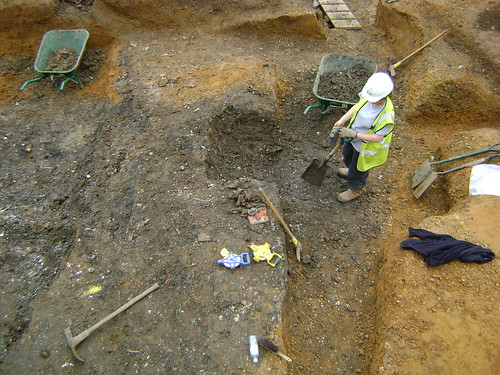 Paula digging a post-medieval brick-lined pit