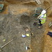 Paula digging a post-medieval brick-lined pit