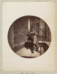 Seated man reading a book