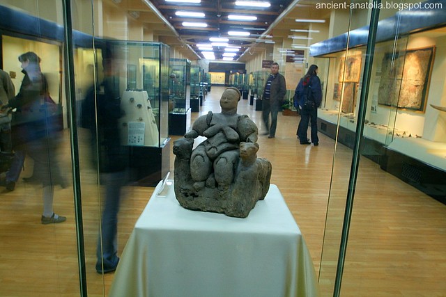 Cybele figurine found at Çatalhöyük, dating about 6000 BCE, 8000 years ago, corpulent and fertile Mother Goddess in the process of giving birth while seated on her throne, which has two hand rests in the form of lion's heads, in Archaeological Museum, Ankara