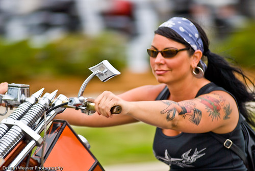 Biker babe on a chopper she entered in the Willie's Tropical Tattoo "old 