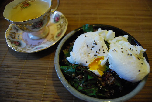 Leftover quinoa stuffing with wilted beet greens and poached eggs