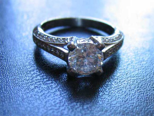 Engagement ring with a carved white gold and diamonds. 