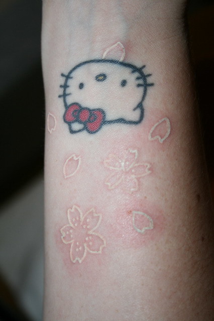White ink sakura tattoo done in Osaka, Japan.