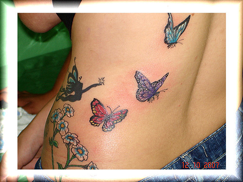 tattoos de flores. tatuagem borboletas e flores
