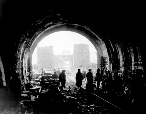Army men and equipment pour across the Remagen Bridge