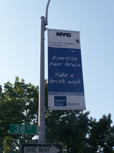 Street banner promoting healthy behavior: walking, Astoria, Queens