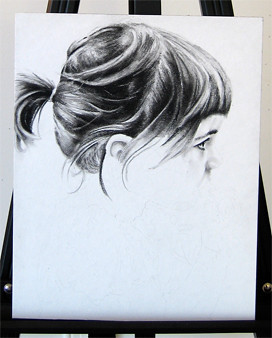 In progress photo of carbon pencil drawing entitled Clara, Profile