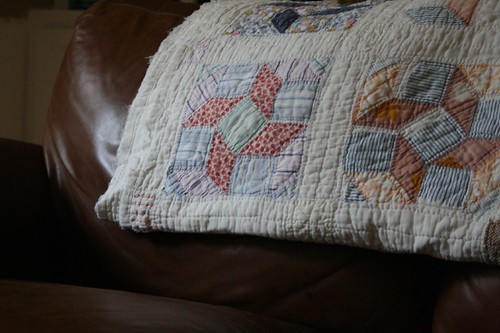old quilt on love seat