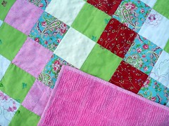 detail of girly patchwork quilt with chenille back