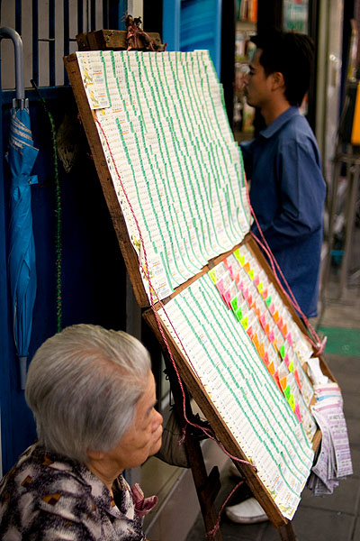 Selling lottery tickets in Bangkok's Chinatown