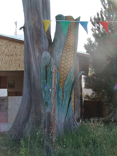 giant carved ear of corn from tree trunk