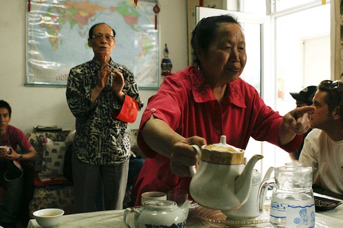 Our host, Mr. Chen, describes his take on Chinese culture while Mrs. Chen offers us hot tea.
