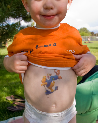 Isaac showed off his cool new Winnie the Pooh tattoo on his belly.