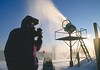 A snowmaker blows snow onto Wintergreen Resort, Virginia