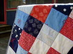 close up of blue red patchwork quilt