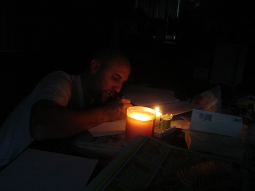 Beau doing homework by candle light