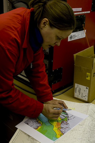 Dr Carol Cotterill reviews the charts and prepares a marine geophysical survey line plan
