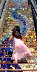 Girl runs up San Francisco's 16th Avenue Tiled Steps