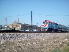Eastbound Metra commuter train passing the Union Pacific M-19A diesel shop. Chicago Illinois. June 2007.