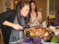 Cori pretends to cut turkey