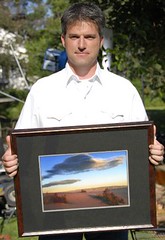 Scott holding one of his landscapes