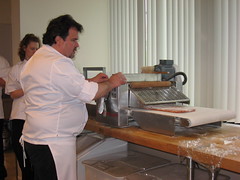 Pierre Hermé: Passing the tomato puff pastry through the sheeter machine (another view)