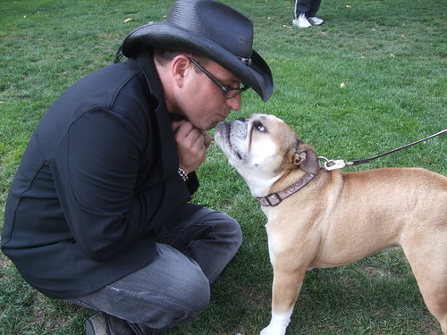 Boutin kissing a bulldog