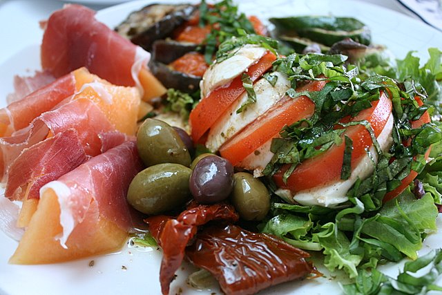 The glorious Antipasto set - parma ham, melon, Caprese salad and grilled vegetables