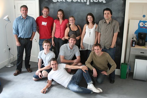 The Carsonified Team posing in front of the blackboard
