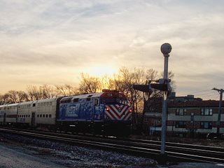 Eastbound Metra morning commuter local passing through Elmwood Park Illinois. January 2007.