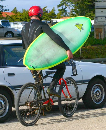 Surfer on bicycle