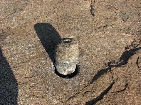 grinding stone set in rock turahalli