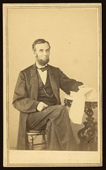 [Abraham Lincoln, U.S. President. Seated portrait, holding glasses and newspaper, Aug. 9, 1863] (LOC)