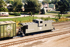 Gray Illinois Central "New Image" caboose. Chicago Illinois. May 1987.