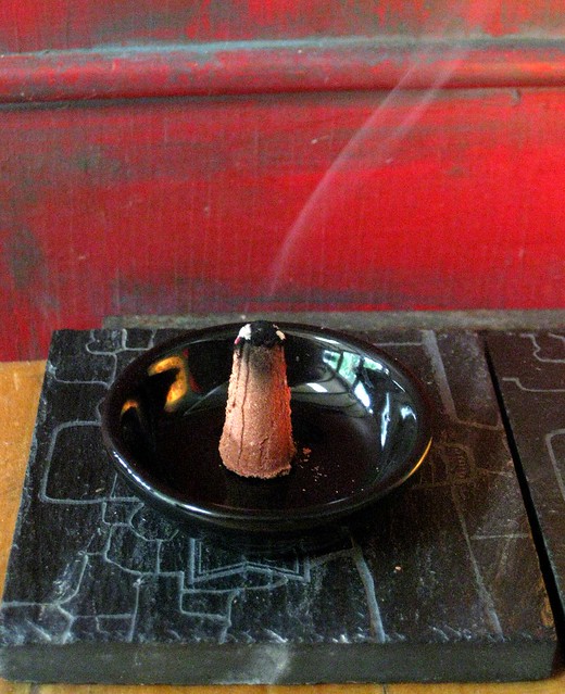 Paine's red cedar incense, burning