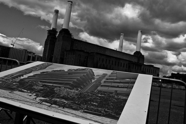 Battersea Power Station with a picture of the proposed redevelopment in the foreground
