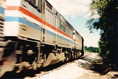Eastbound Amtrak speeding through Willow Springs Illinois. September 1988.